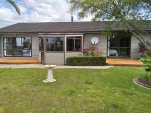 a house with a bird bath in the yard at Carters Beach Bed and Breakfast in Westport