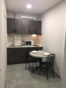 Η κουζίνα ή μικρή κουζίνα στο Апартаменты Weekend Inn