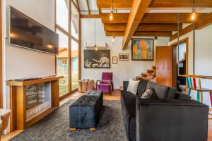 a living room with a couch and a fireplace at El Cielo in Canela