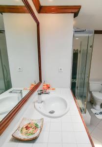 a bathroom with a sink and a toilet at Exclusive penthouse with paradise sea view in Grand-Baie