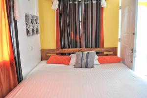 Ein Bett oder Betten in einem Zimmer der Unterkunft De luz Hotel