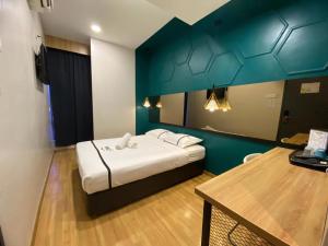 Postel nebo postele na pokoji v ubytování Smile Hotel Selayang Point