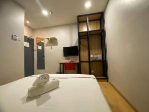 Postel nebo postele na pokoji v ubytování Smile Hotel Selayang Point
