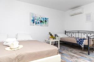 Posteľ alebo postele v izbe v ubytovaní Depis Luxury Suites