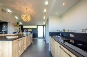 A kitchen or kitchenette at Maison Anne Fouquet