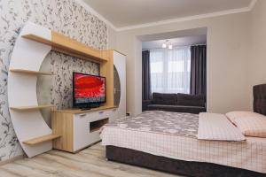 Postel nebo postele na pokoji v ubytování center apartments zarechny residential complex