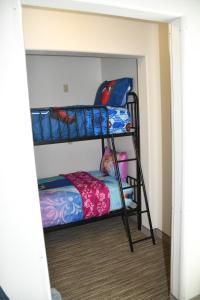 a bunk bed room with two bunk beds at Holiday Inn Express Hotel & Suites Evanston, an IHG Hotel in Evanston