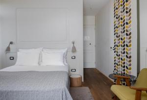 Ένα ή περισσότερα κρεβάτια σε δωμάτιο στο Hotel Peteani