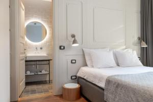 Ένα ή περισσότερα κρεβάτια σε δωμάτιο στο Hotel Peteani
