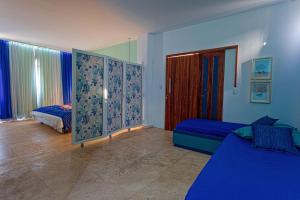 Postel nebo postele na pokoji v ubytování Bruno Marambaia Charme Hotel