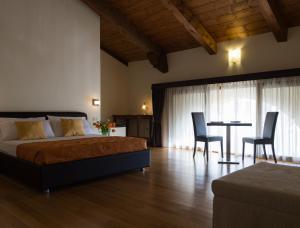 A bed or beds in a room at Residence Cà Beregana