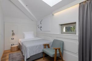 Ένα ή περισσότερα κρεβάτια σε δωμάτιο στο Hotel Peteani