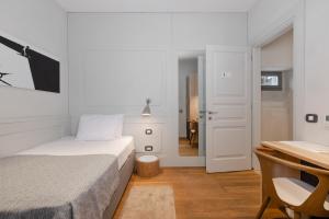 Ένα ή περισσότερα κρεβάτια σε δωμάτιο στο Hotel Peteani