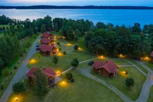 an aerial view of a resort with lights on the grass at Alauso Slenis in Sudeikiai