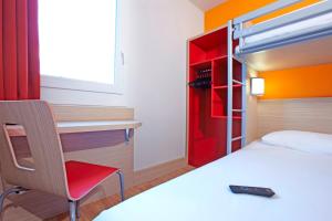 Llit o llits en una habitació de Première Classe Roissy - Aéroport CDG - Le Mesnil-Amelot