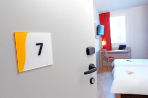 Televisor o centre d'entreteniment de Première Classe Roissy - Aéroport CDG - Le Mesnil-Amelot
