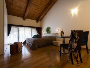 A bed or beds in a room at Residence Cà Beregana