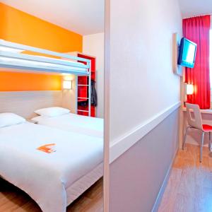 Llit o llits en una habitació de Première Classe Roissy - Aéroport CDG - Le Mesnil-Amelot