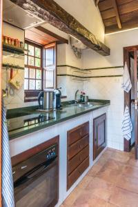 Una cocina o zona de cocina en Casa Palmera