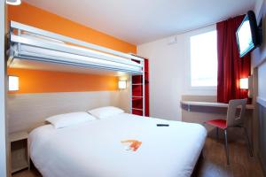 Llit o llits en una habitació de Première Classe Roissy - Aéroport CDG - Le Mesnil-Amelot