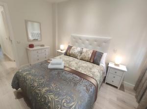 Posteľ alebo postele v izbe v ubytovaní Apartamento Rosa Park