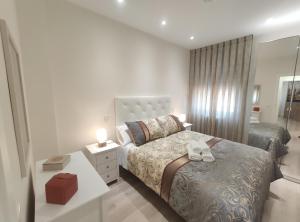 Posteľ alebo postele v izbe v ubytovaní Apartamento Rosa Park