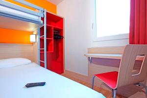 Llit o llits en una habitació de Première Classe Roissy - Aéroport CDG - Le Mesnil-Amelot