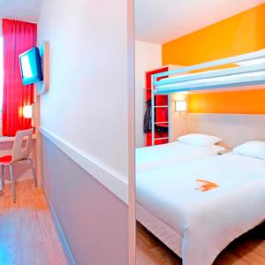 Llit o llits en una habitació de Première Classe Roissy - Aéroport CDG - Le Mesnil-Amelot