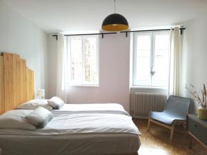 Ένα ή περισσότερα κρεβάτια σε δωμάτιο στο L'écrin de Masevaux