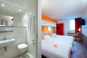 Llit o llits en una habitació de Première Classe Roissy - Aéroport CDG - Le Mesnil-Amelot