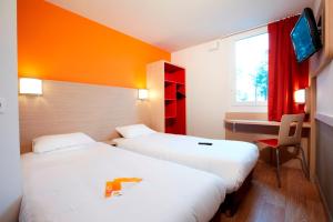 Llit o llits en una habitació de Première Classe Roissy - Aéroport CDG - Le Mesnil-Amelot