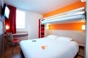 Llit o llits en una habitació de Première Classe Roissy - Aéroport CDG - Le Mesnil-Amelot