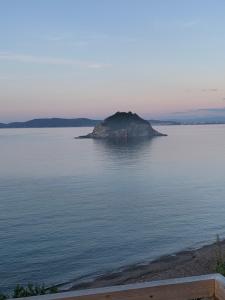 an island in the middle of a large body of water at PUNTA dei BARBARI #MAESTRALE #LIBECCIO #TRAMONTANA in Cavo