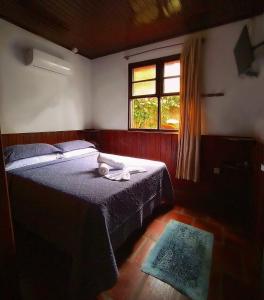 Giường trong phòng chung tại Pousada do Pescador