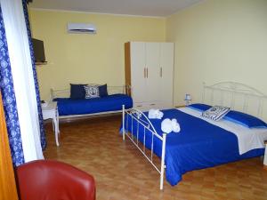 Кровать или кровати в номере Perla del Sud