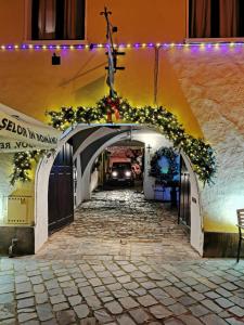 a car driving through a tunnel with a christmas decoration at Guesthouse Postavarului in Braşov