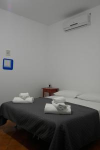 Postel nebo postele na pokoji v ubytování Casa Iolanda