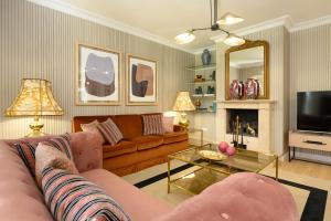 a living room with a couch and a table at Hotel Boutique San Diego - Adults Only in Las Lagunas