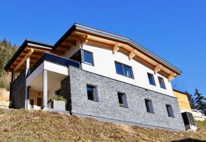 a house on top of a hill at Chalet Maria in Ochsengarten