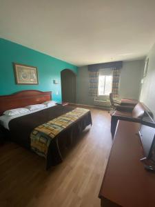 Katil atau katil-katil dalam bilik di Tropicana Inn and Suites
