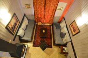 an overhead view of a room with couches and a television at Aphrodite's Inn Kalavrita in Kalavrita