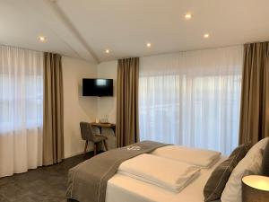 TV a/nebo společenská místnost v ubytování Hotel Sleep & Dream Nähe Europa Park und Rulantica