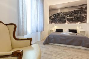 Un pat sau paturi într-o cameră la RelaisApartments MERCEDE - Extraordinary Hospitality