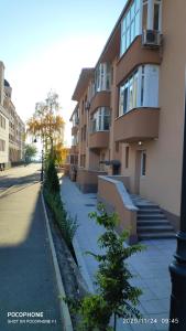 a building with a sidewalk next to a building at UNIQUE LOCATION APARTMENT WITH PARKING in Burgas City +54 photos
