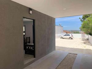 a room with a window and a car in a building at Depto a Estrenar 4 pax con Cochera Equipado a Full in Mar del Plata