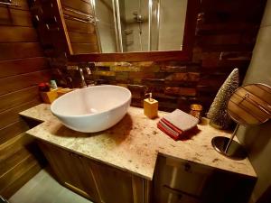 a bathroom with a bowl sink on a counter at Cozy mountain apartment in Platres in Platres