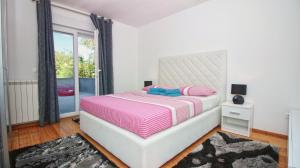 Postel nebo postele na pokoji v ubytování Guesthouse Esma