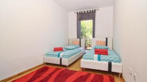 Postel nebo postele na pokoji v ubytování Guesthouse Esma
