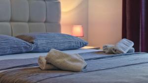 Postel nebo postele na pokoji v ubytování Guesthouse Esma