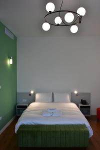 Postel nebo postele na pokoji v ubytování Osten Art Hotel